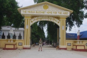 Home for the Bagan elderly Me flanked by statues of old people